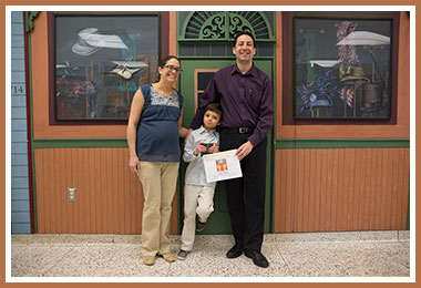 Alex with his proud parents 

